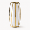 Tall luxury white ceramic vase with gold accents on white background