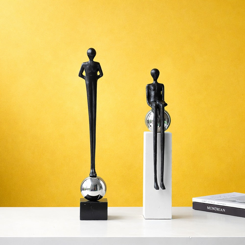 Modern abstract alloy figure sculptures in standing and sitting styles with chrome sphere bases