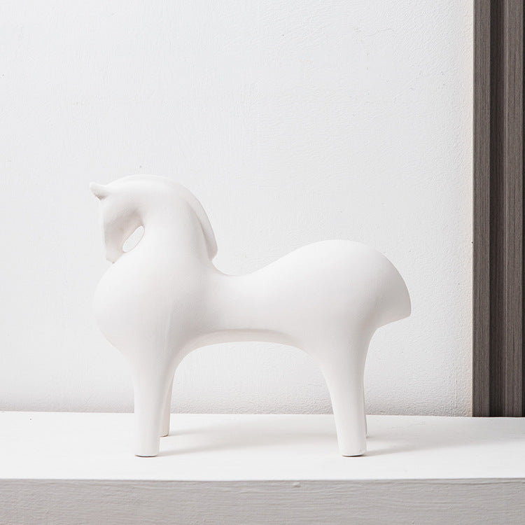 White ceramic horse sculpture decor with minimalist rounded silhouette