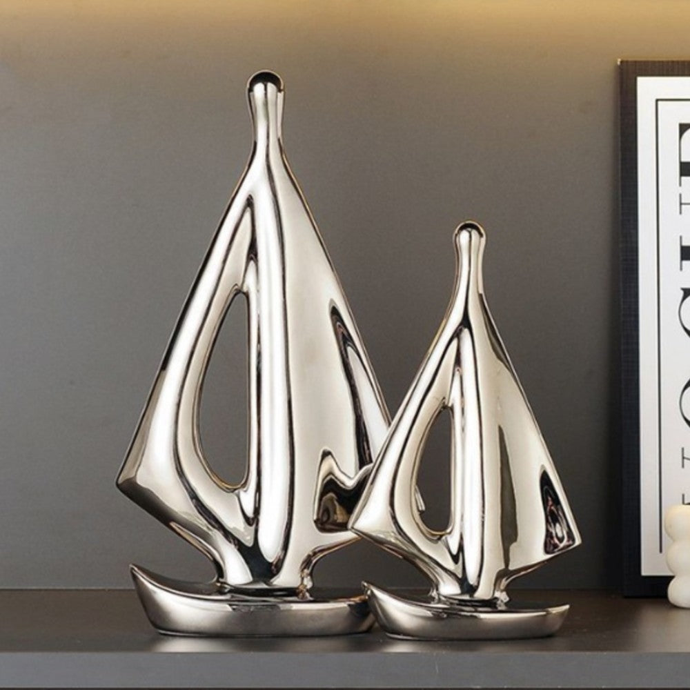 Silver ceramic sailboat sculpture set for modern nautical home decor
