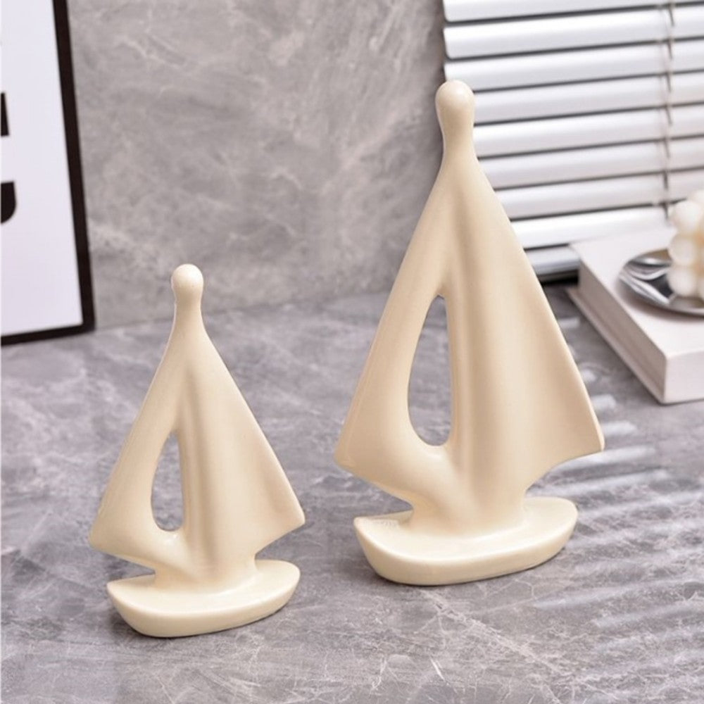 Cream ceramic sailboat sculpture set in large and small sizes for shelf decor