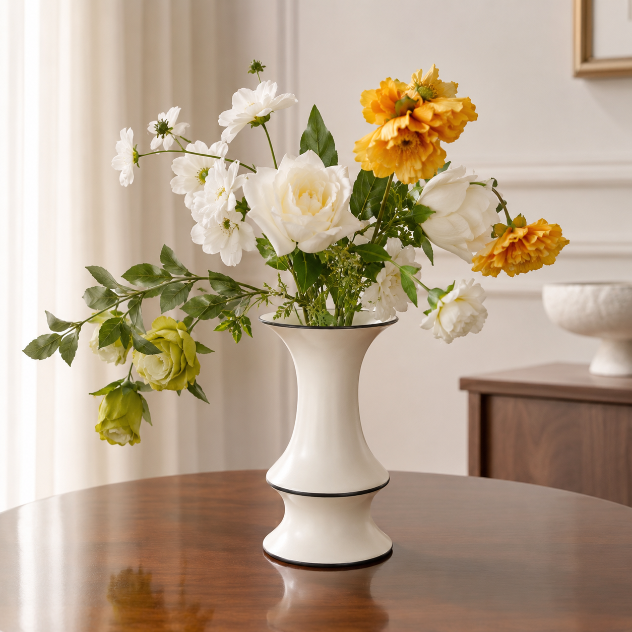 Ivory ceramic vase with mixed flowers on wooden table in elegant interior