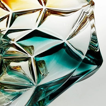 Close up of geometric glass bowl rim showing angular faceted pattern