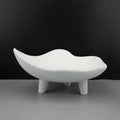 Empty white wavy resin decorative bowl on short tripod legs