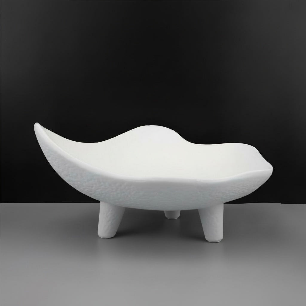 Empty white wavy resin decorative bowl on short tripod legs