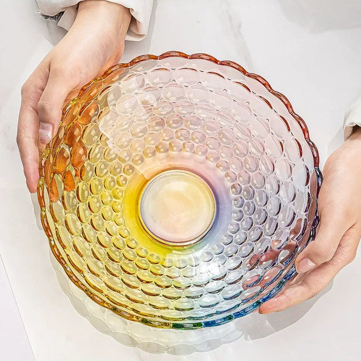 Hand holding textured bubble glass bowl to show the rounded base and glass pattern