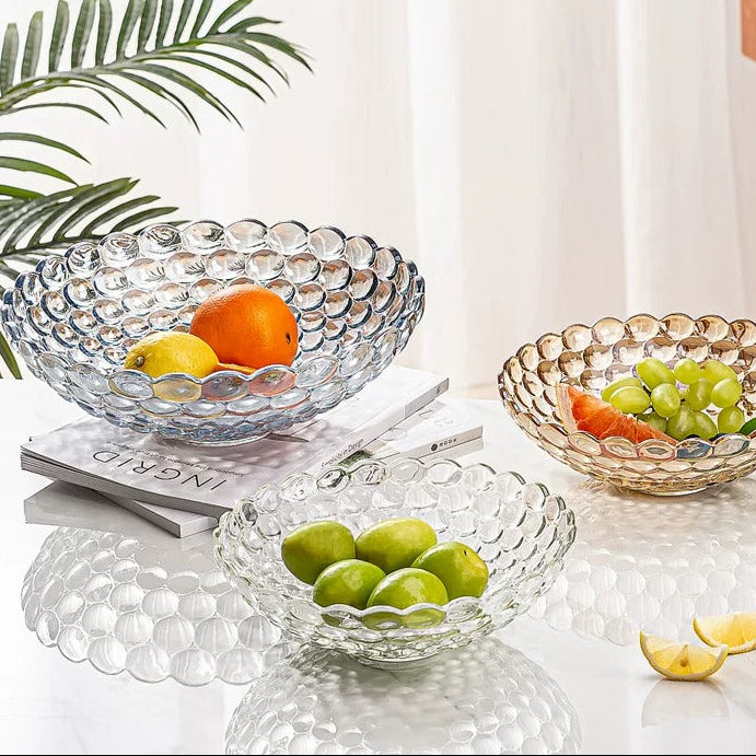 Iridescent and clear bubble glass bowls styled with fruit in a bright modern setting