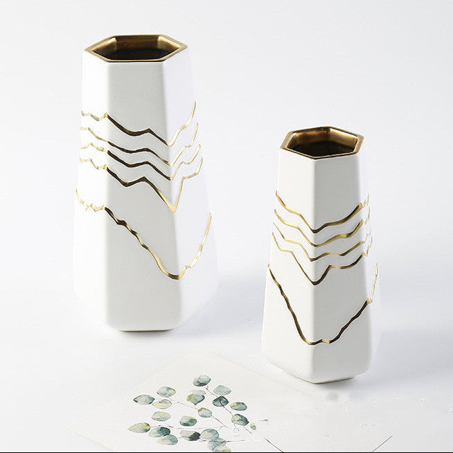 White ceramic vase set with gold mountain lines and modern geometric shape