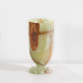 Green marble pedestal vase product photo with polished natural stone pattern on white background