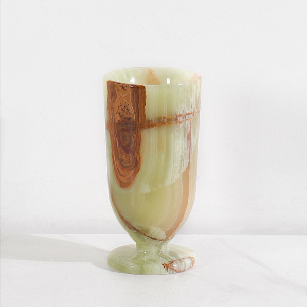 Green marble pedestal vase product photo with polished natural stone pattern on white background