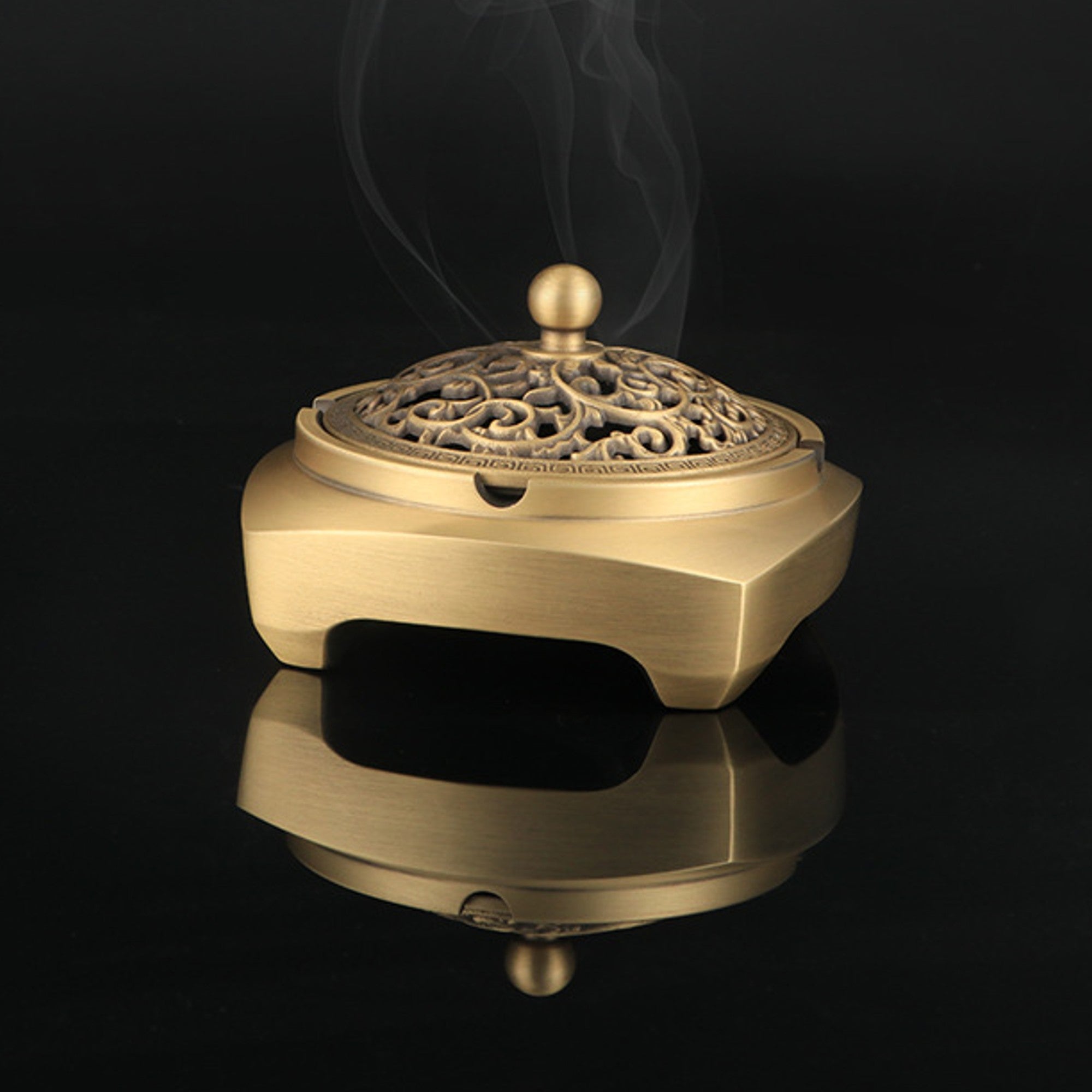 Ornate brass incense burner with smoke for home fragrance and rituals