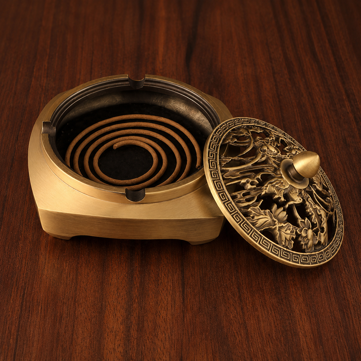Brass incense burner with lid open and coil incense inside