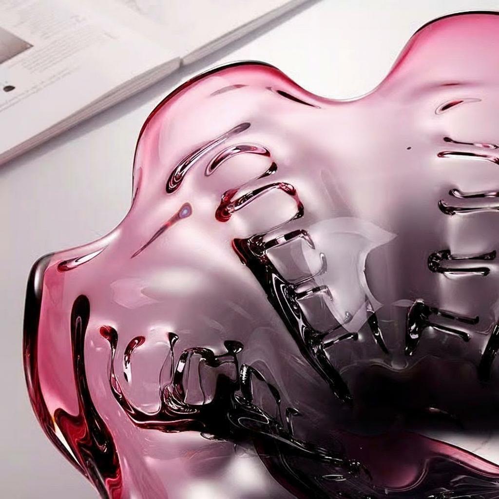 Close up of plum gradient glass bowl with glossy sculptural details