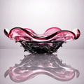 Plum and smoky black ruffled glass centerpiece bowl with reflective surface