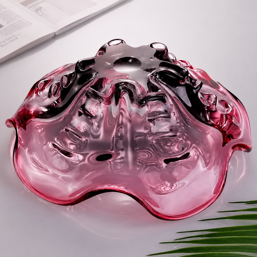 Underside of plum gradient ruffled glass centerpiece bowl showing sculptural glasswork