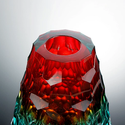 Top view of red faceted glass vase showing wide opening and thick glass rim