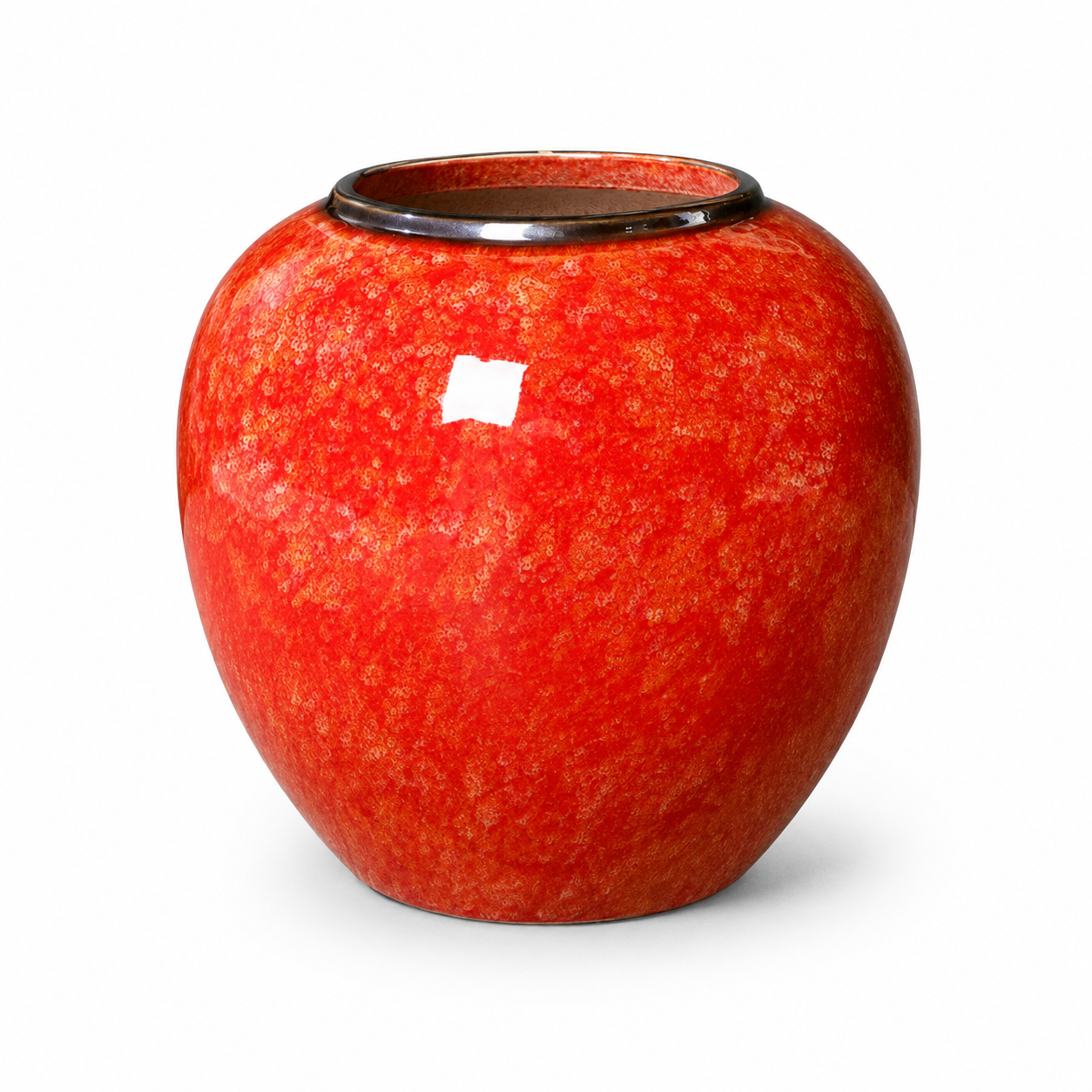 Red glazed round ceramic vase with glossy finish on white background