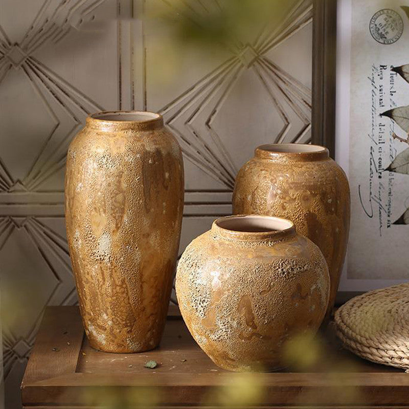 Rustic brown ceramic vases arranged in a cozy interior with soft natural styling