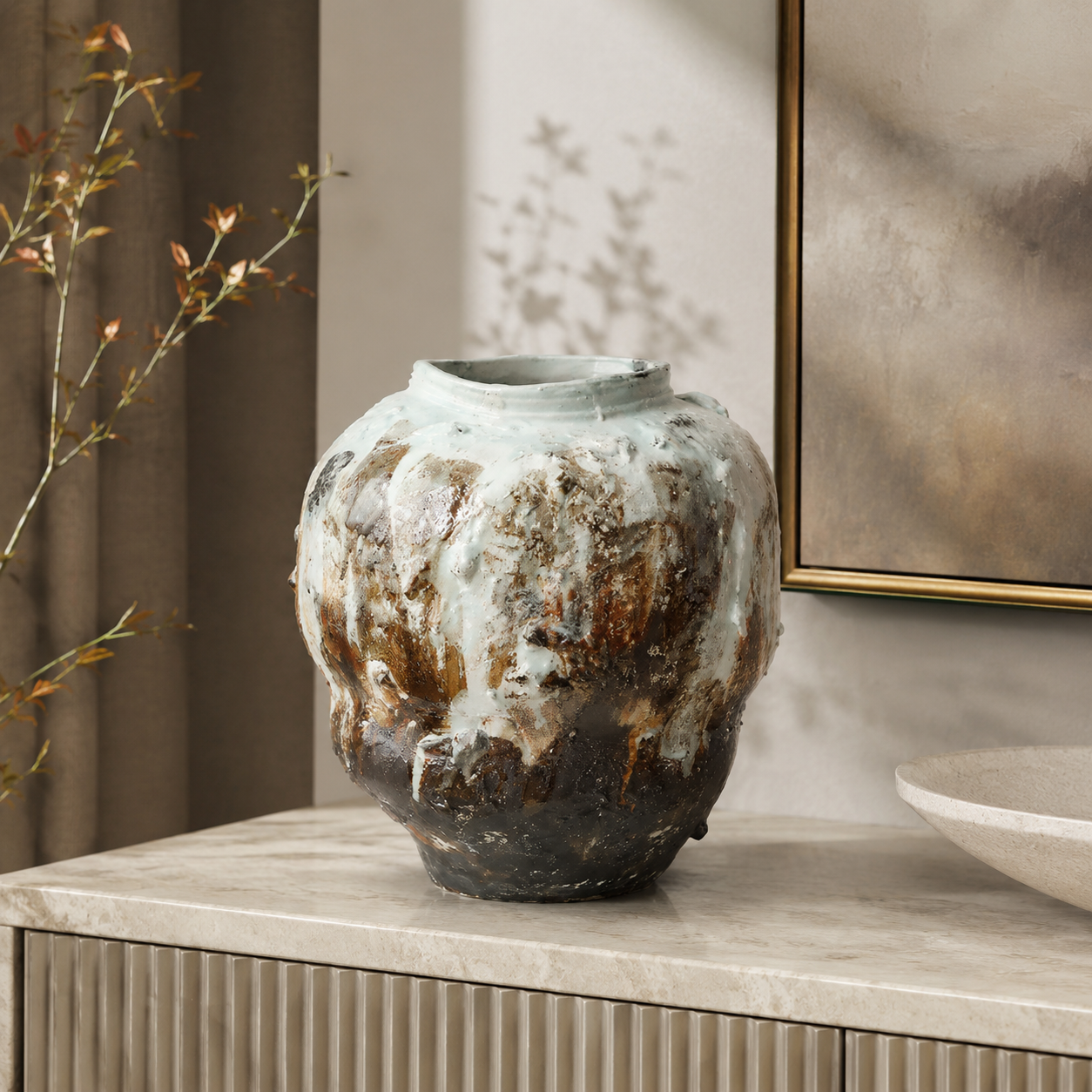 Rustic textured ceramic vase styled on a marble console table for luxury modern home decor