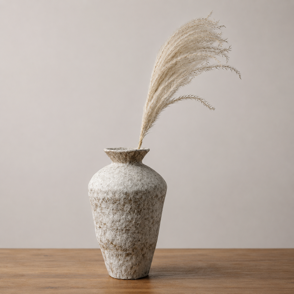 Tall rustic textured ceramic vase styled with pampas grass on a wooden shelf