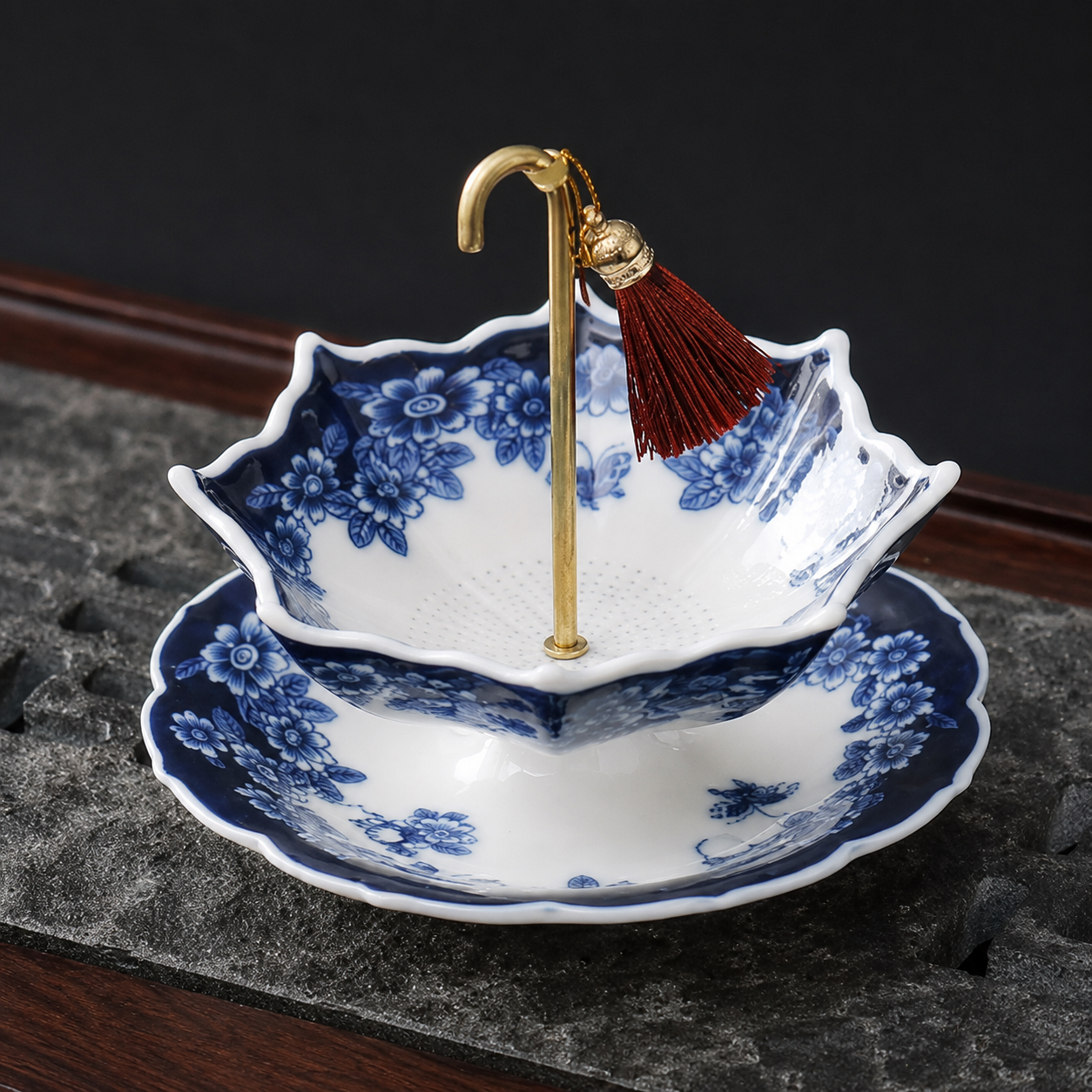 Blue floral ceramic tea strainer with matching drip tray and gold handle