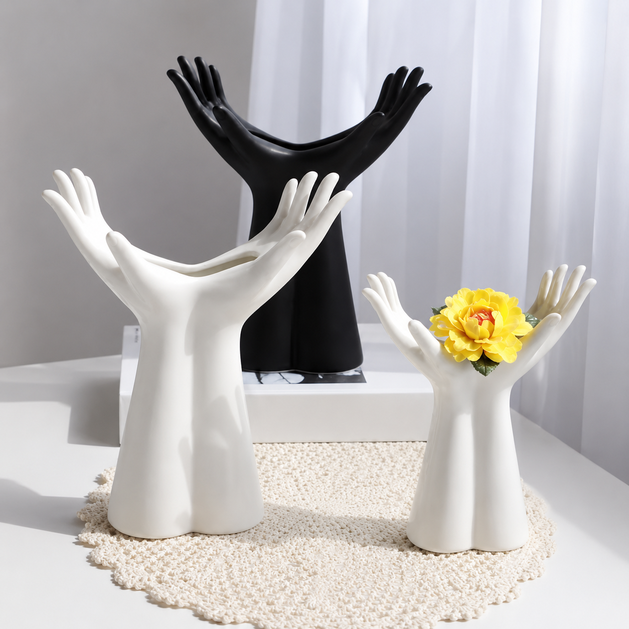 Large and medium ceramic open palm vases styled as modern sculptural home decor