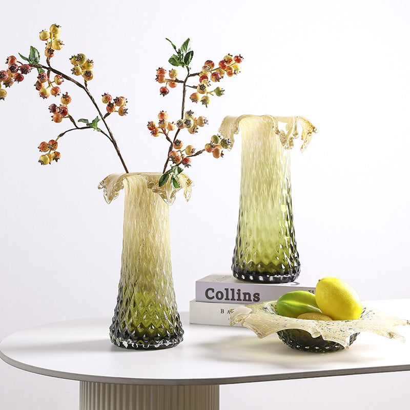 Sculptural faceted glass vases and centerpiece bowl in amber green gradient finish