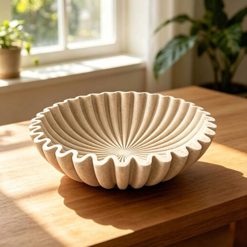 Sandstone fluted resin centerpiece bowl in sunlit modern interior