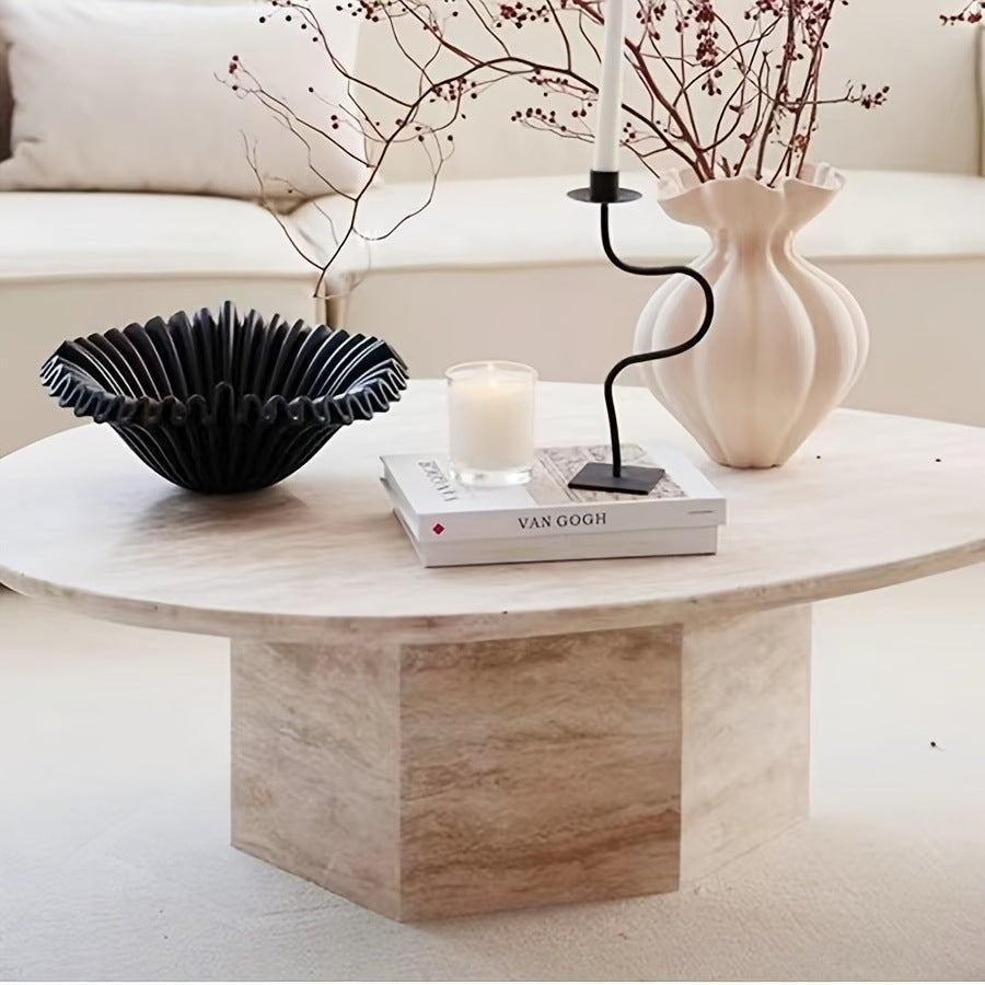 Black ruffled resin centerpiece bowl styled on sculptural side table