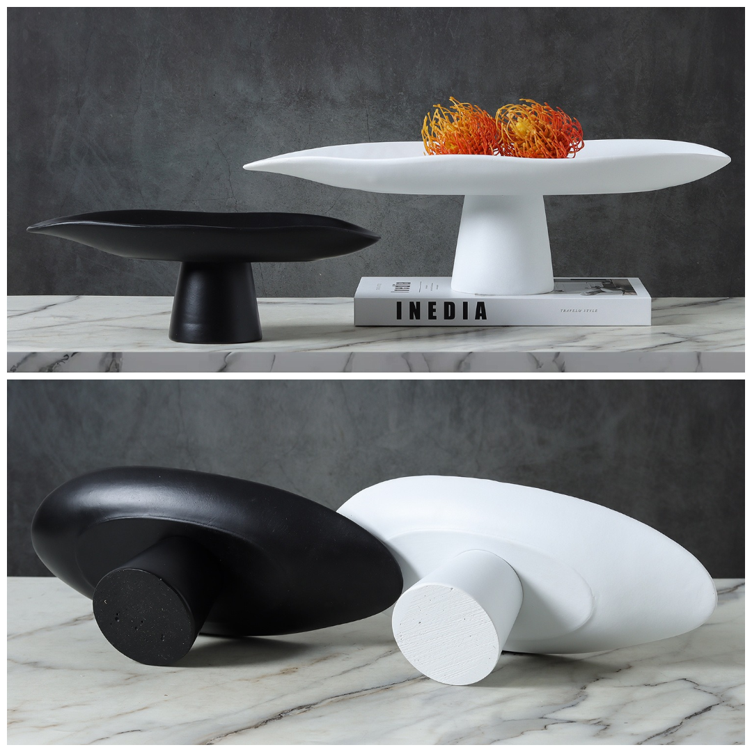 Black and white resin pedestal bowls shown upright and from underside views