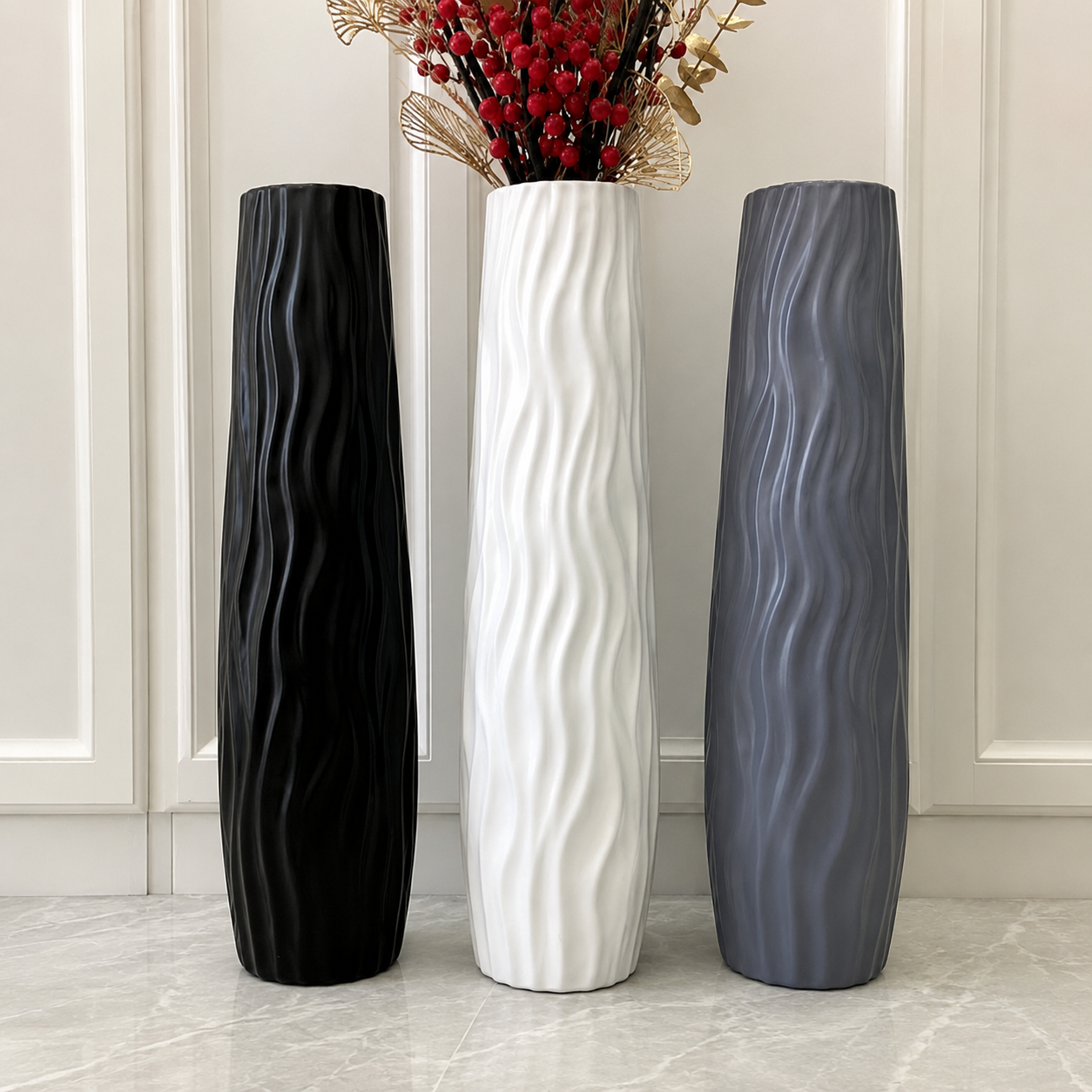 Black white and gray sculptural wavy textured floor vases displayed together