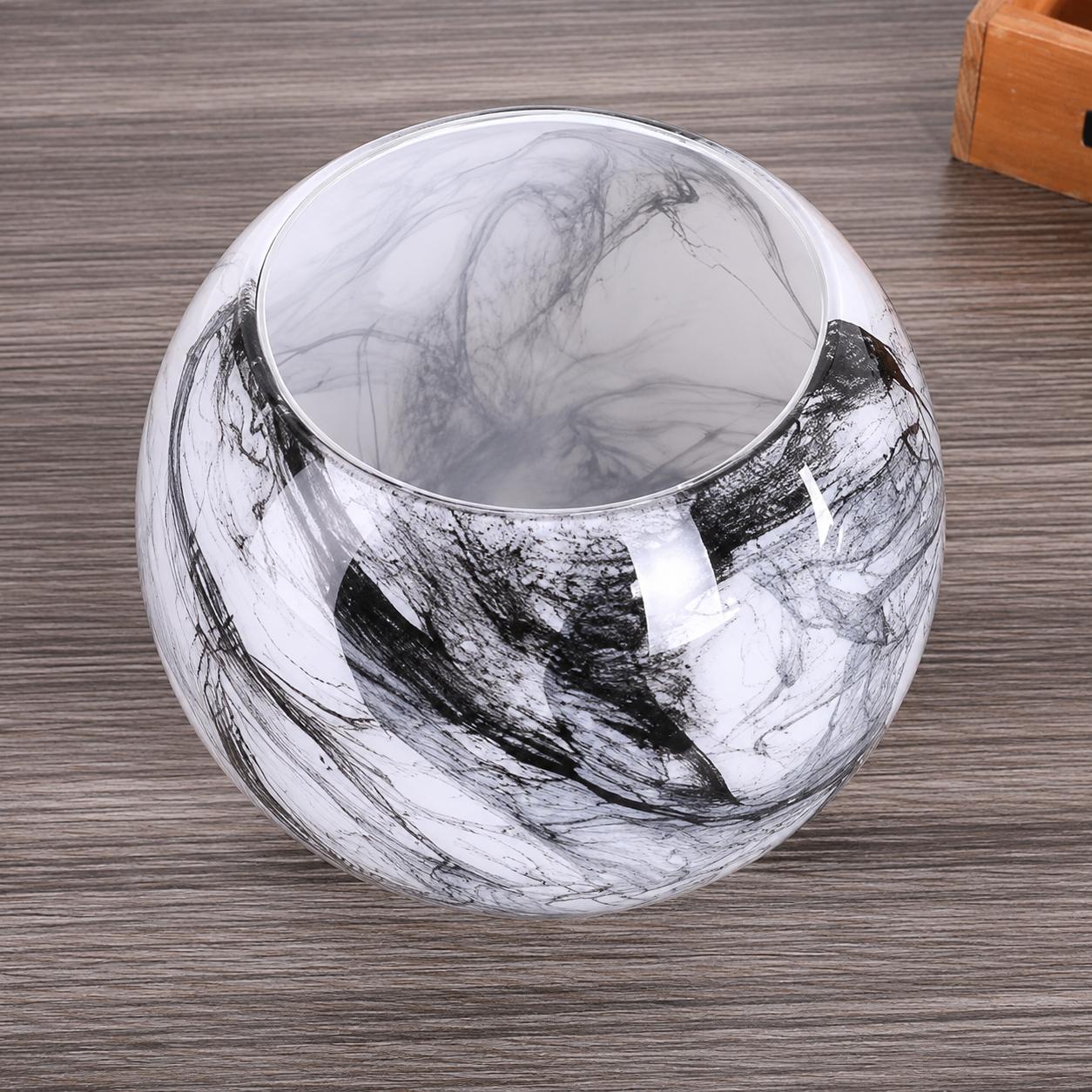 Top view of a smoky black and white marble glass vase