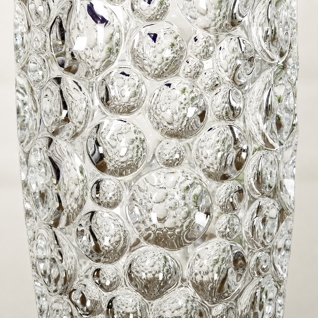 Close up of the raised bubble texture on a clear decorative glass vase