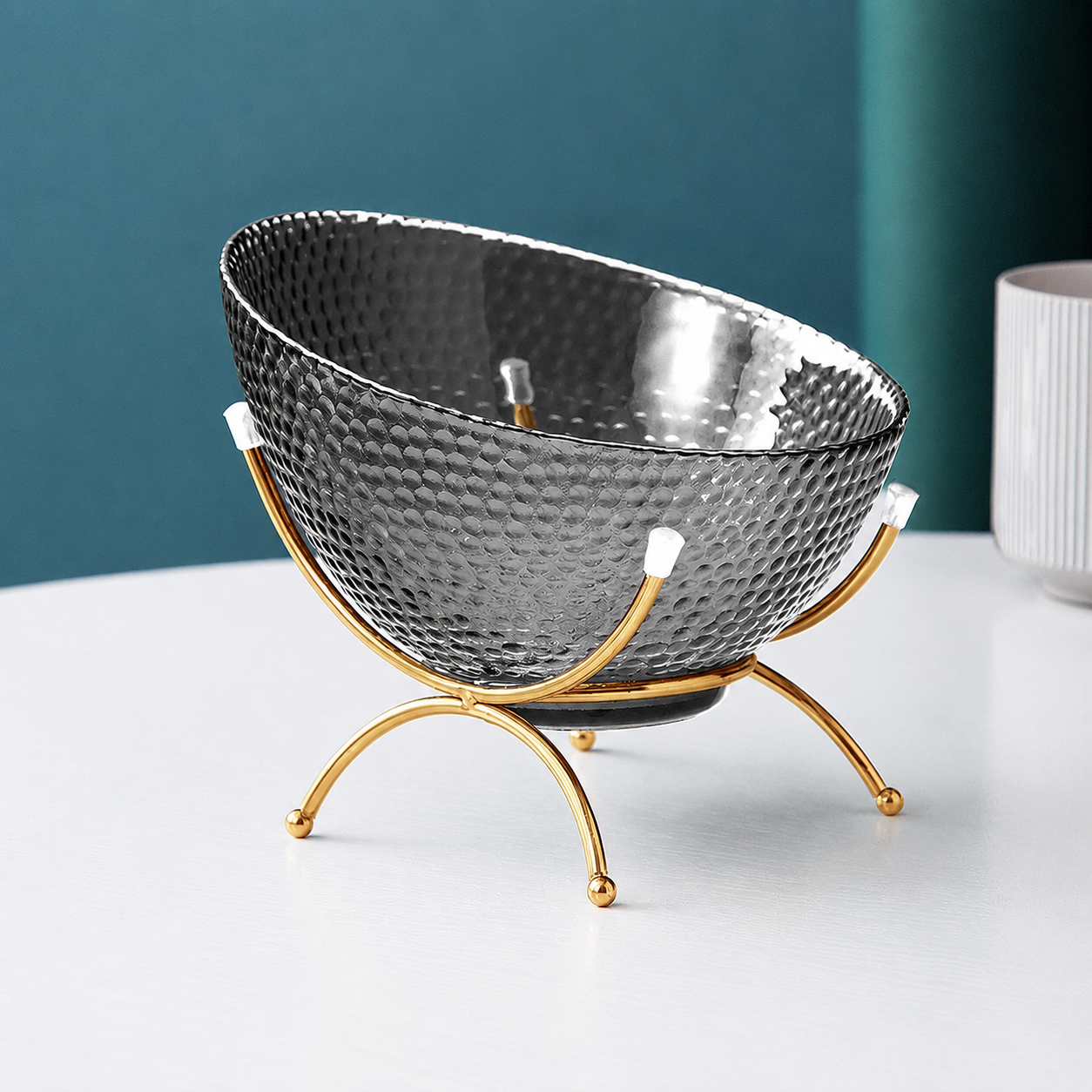 Smoke gray textured glass fruit bowl with gold rim and gold metal stand