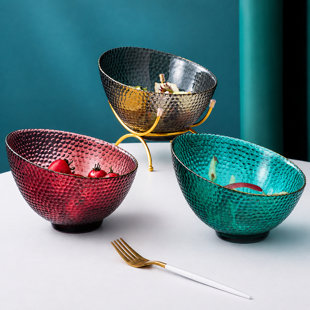 Textured glass fruit bowls in maroon teal and smoke gray with gold rim
