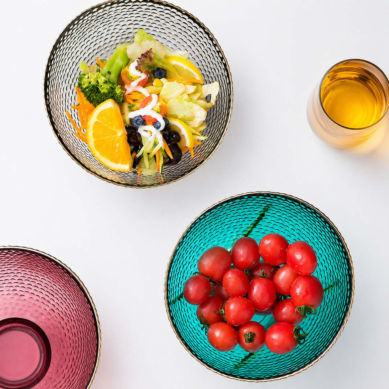 Textured glass bowls used for salad and tomatoes with gold rim detail
