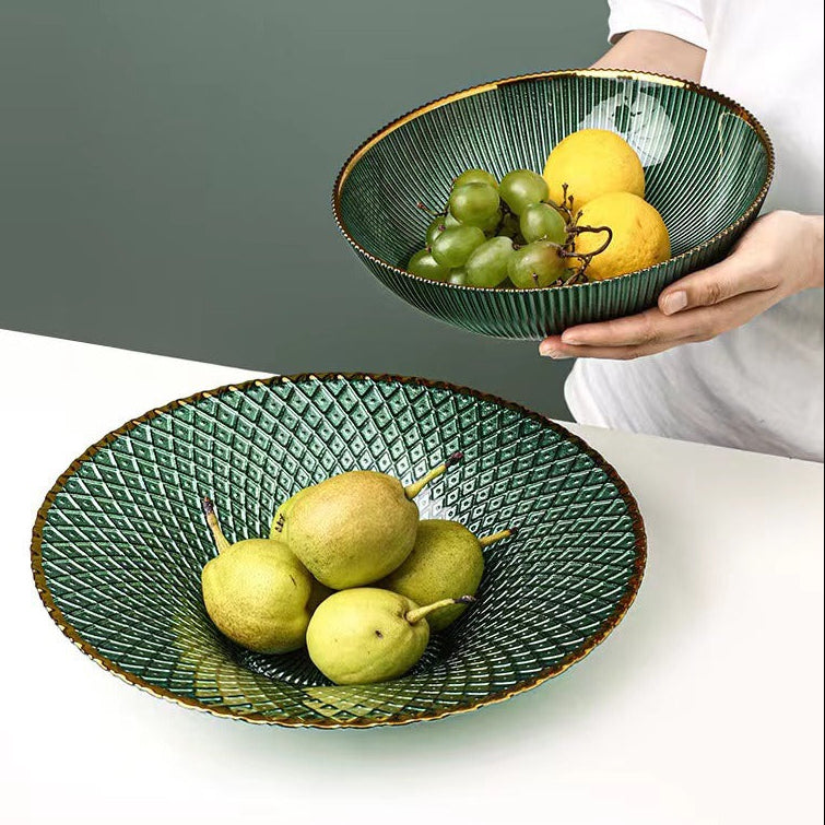 Textured green glass gold rim centerpiece bowls in round and flared shapes styled with fruit
