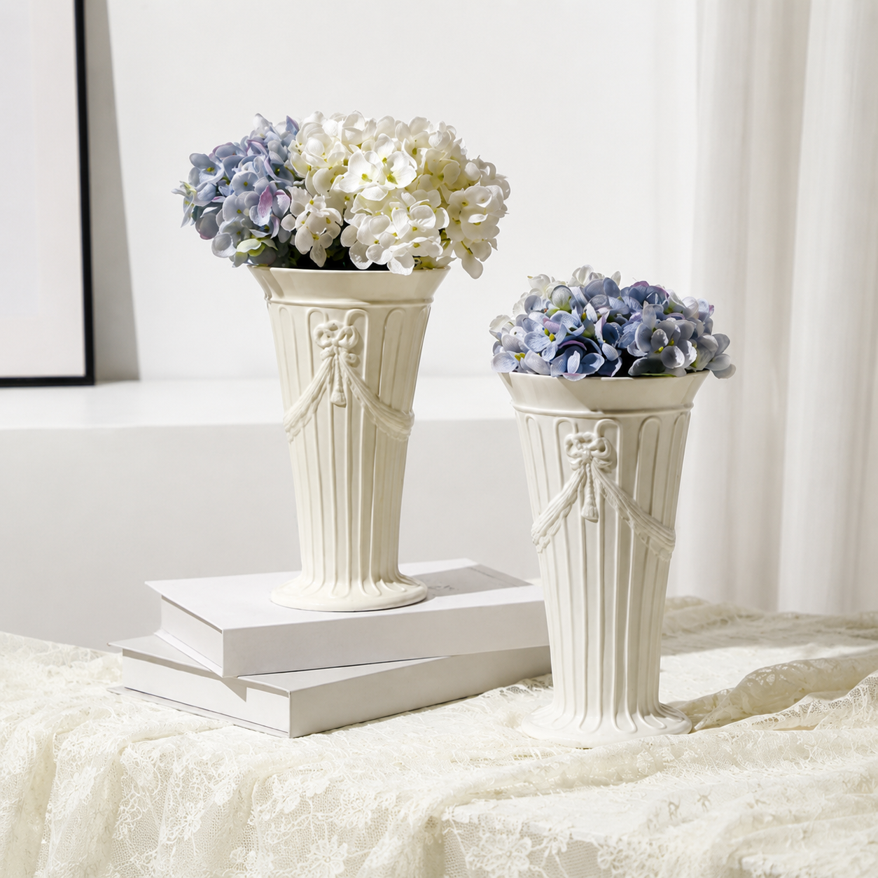 White ceramic Rosette vases with fluted design and hydrangea flower arrangements