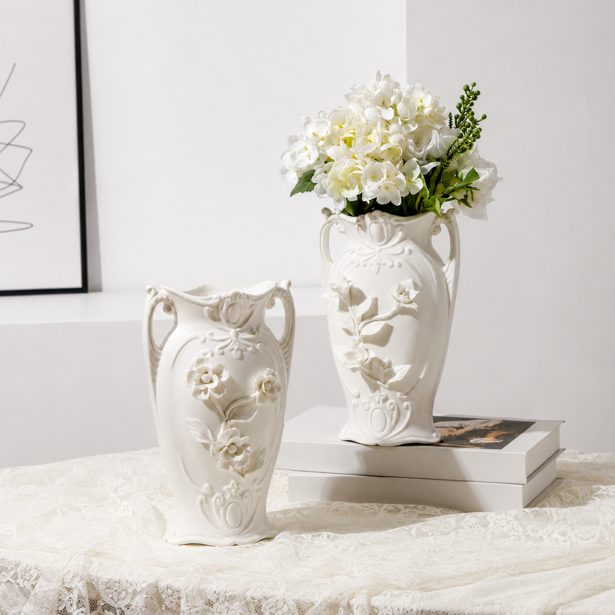 White ceramic Lily and Daisy floral relief vases styled with white flowers