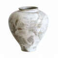Wabi-sabi inspired ceramic vase with abstract white brushstroke finish on white background