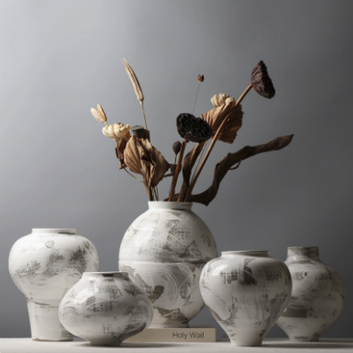 Collection of wabi-sabi inspired ceramic vases styled with dried branches