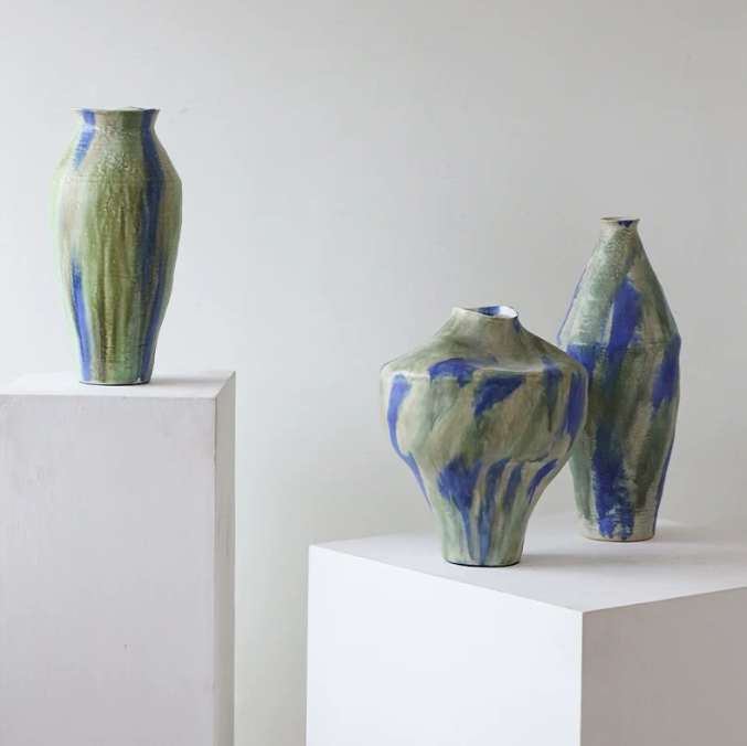 Abstract glazed ceramic vases in wabi sabi style displayed as sculptural decor