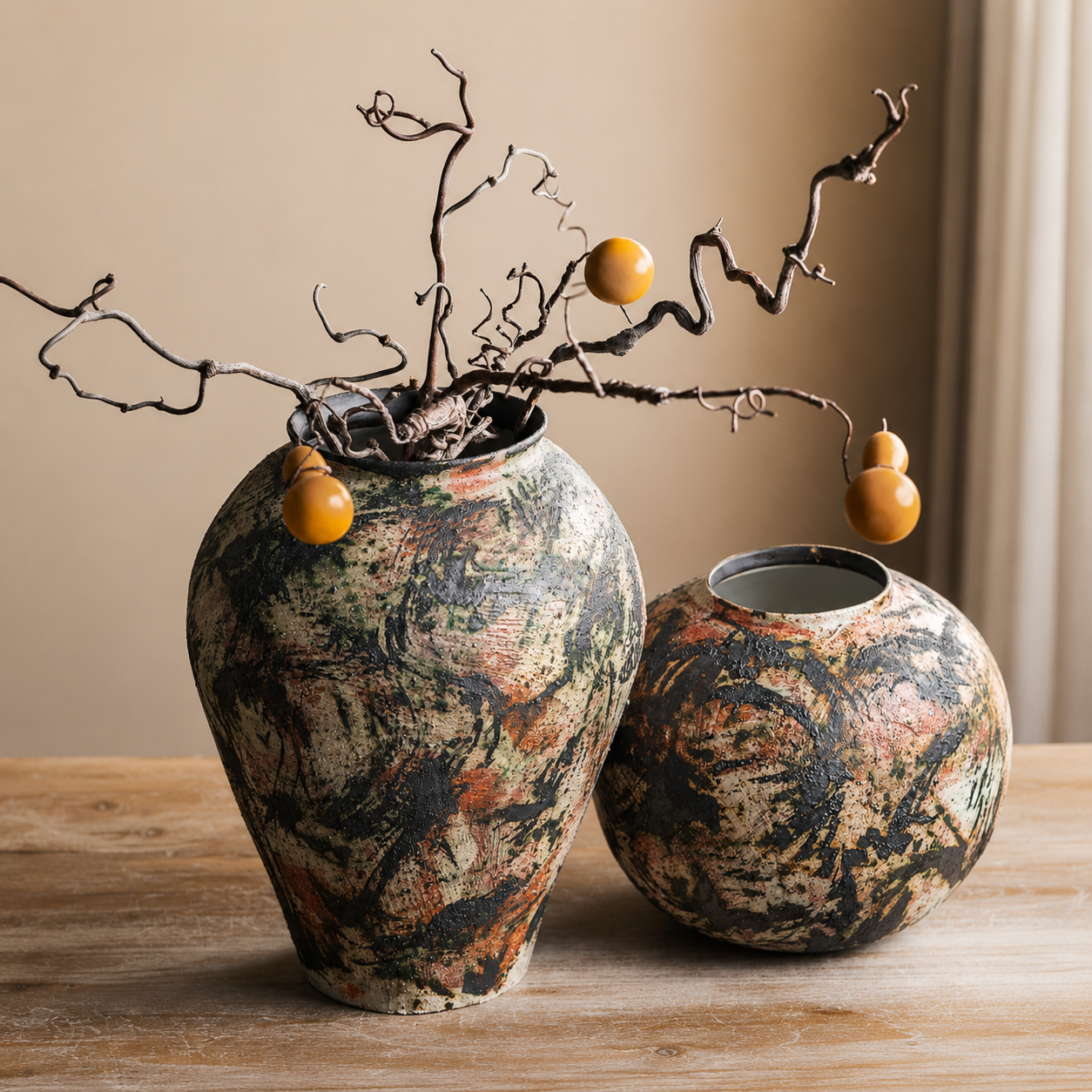 Rustic ceramic vases with twisted branches and orange accents for wabi sabi interior styling