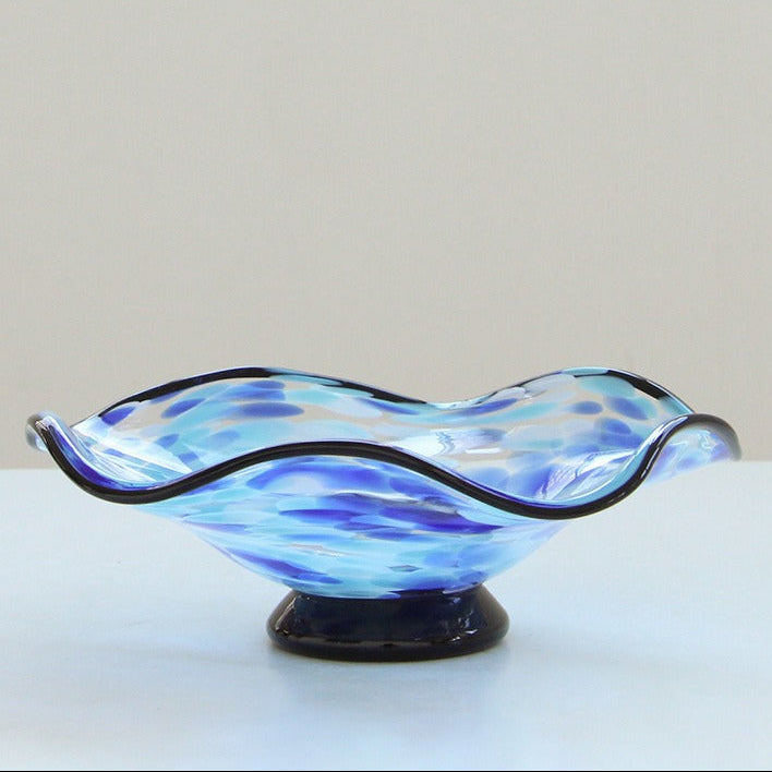 Light Blue Medium wavy art glass centerpiece bowl displayed alone