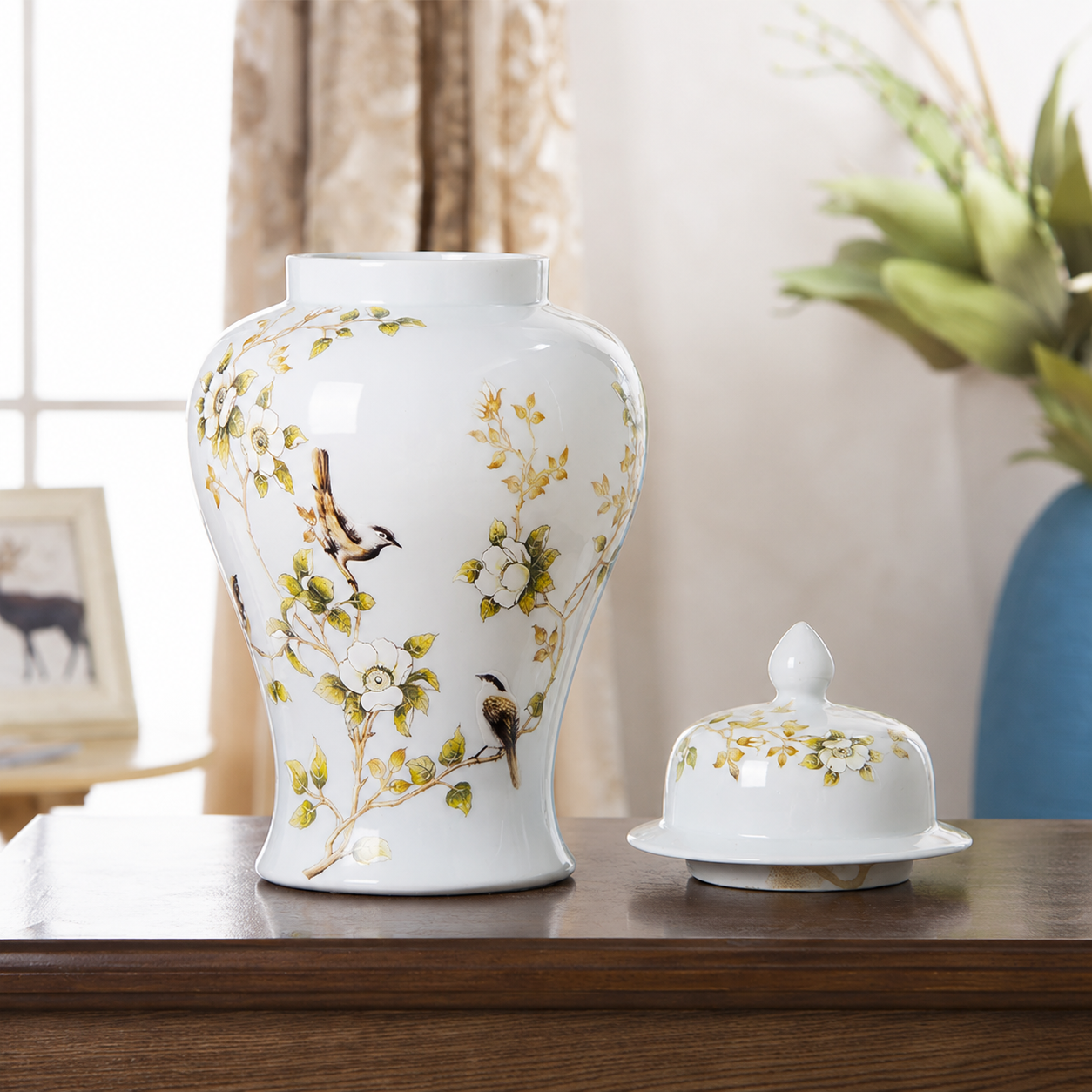 Close-up of white ceramic ginger jar vase with floral bird design and matching lid