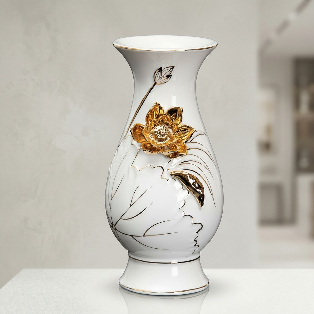 White ceramic vase with 3D gold lotus flower styled in elegant home decor setting