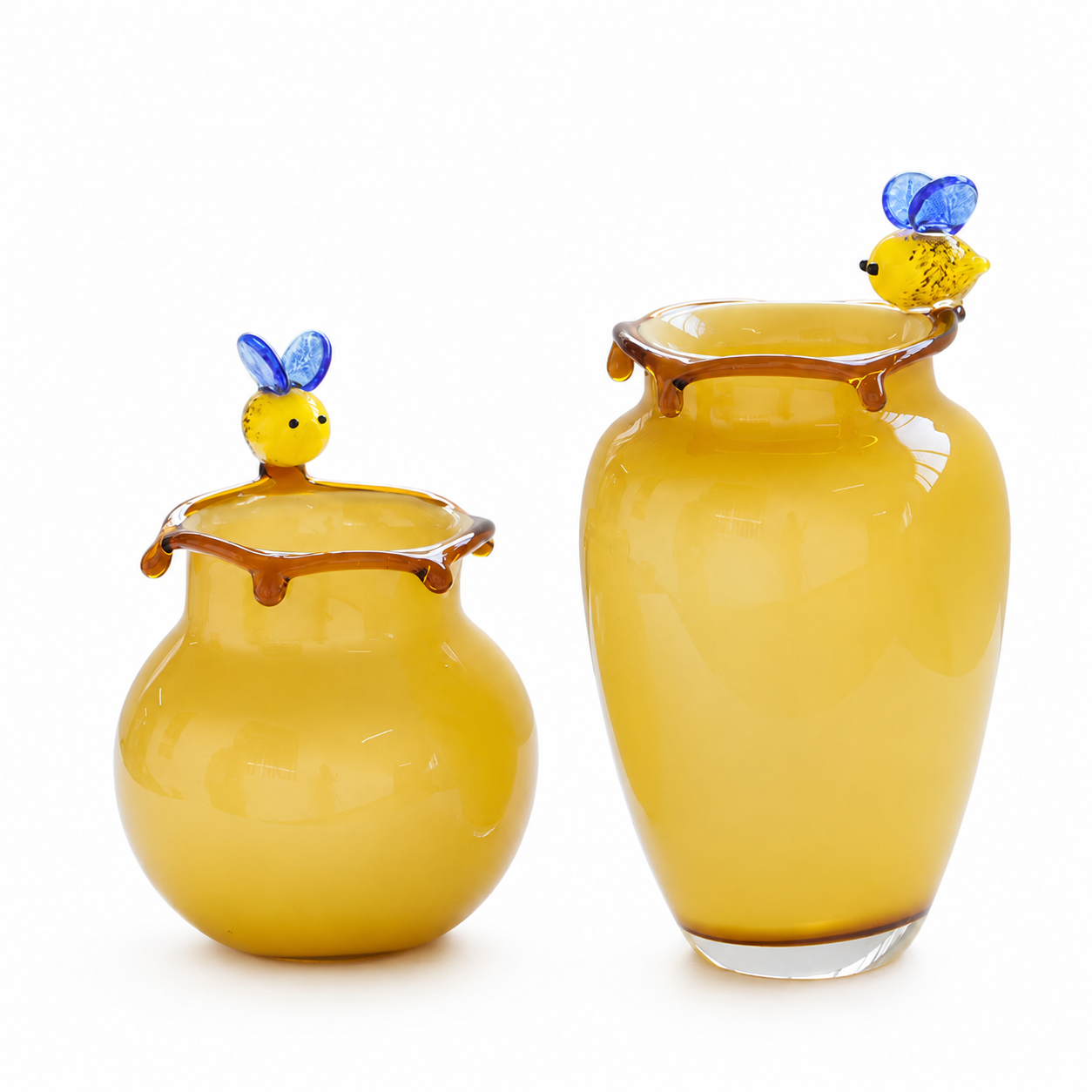 Yellow art glass vases with bee accents and amber honey drip rims in tall and short styles