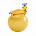 Short round yellow art glass vase with bee accent and glossy honey-colored body