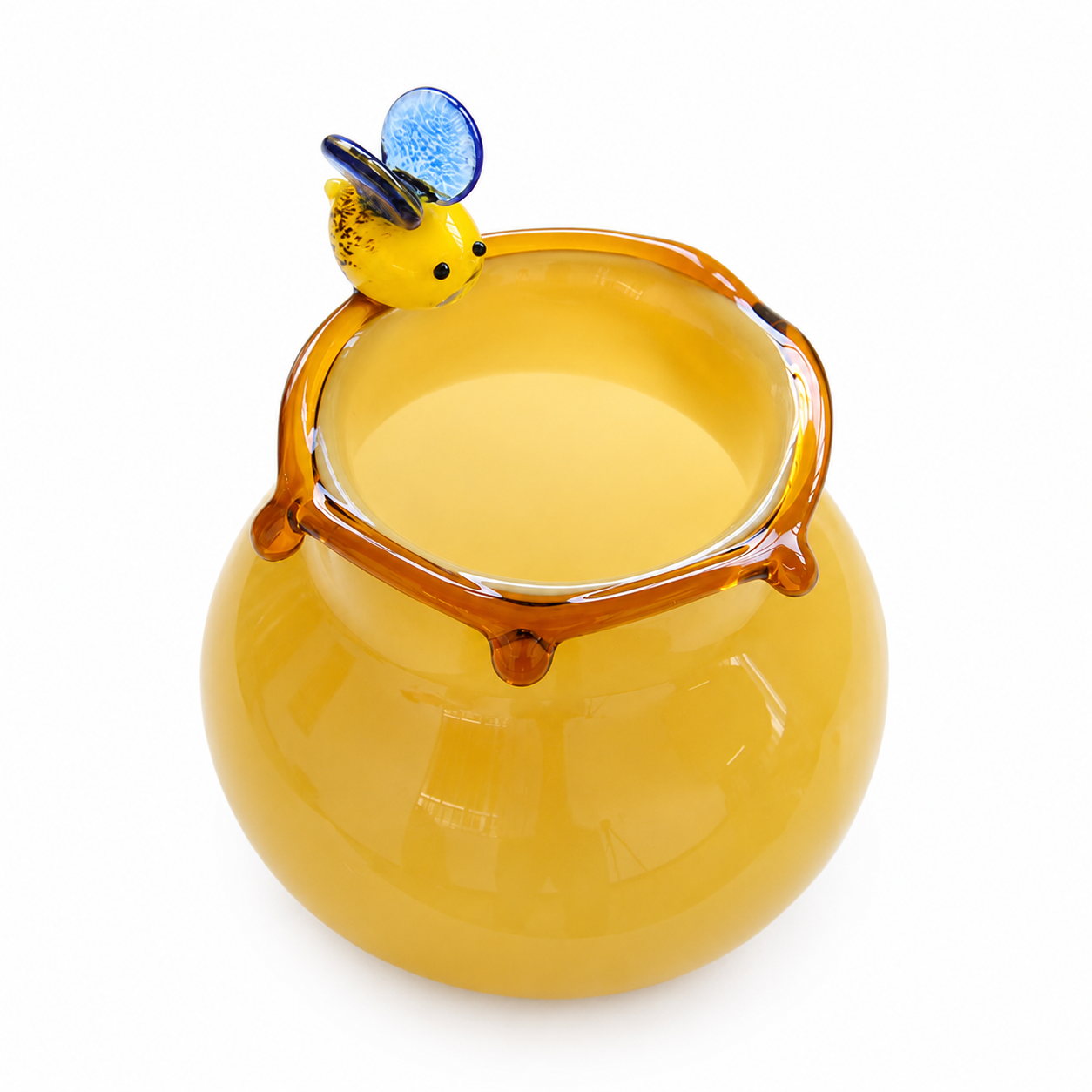 Short round yellow art glass vase with blue wing bee accent and amber drip rim