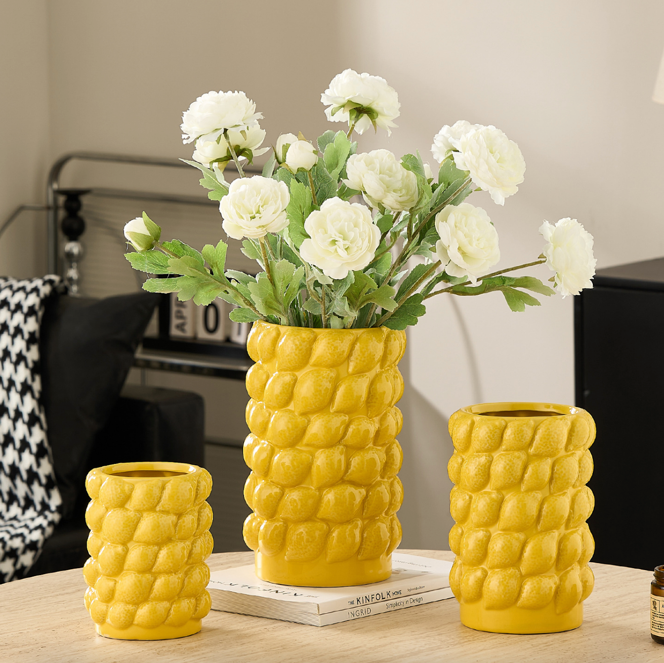 Yellow lemon textured ceramic vases styled with white flowers for luxury home decor